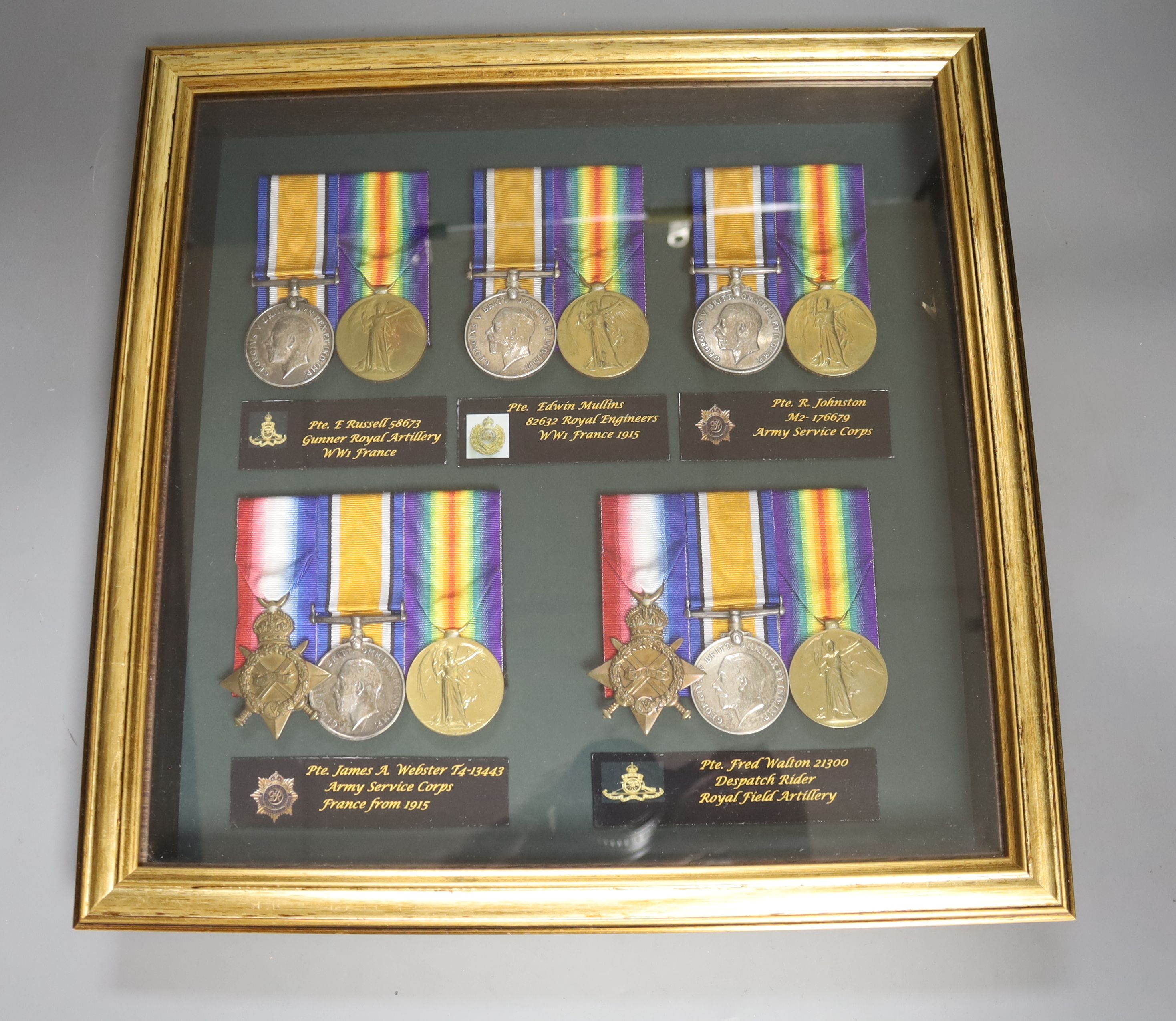 Five WW1 medal groups in one display case